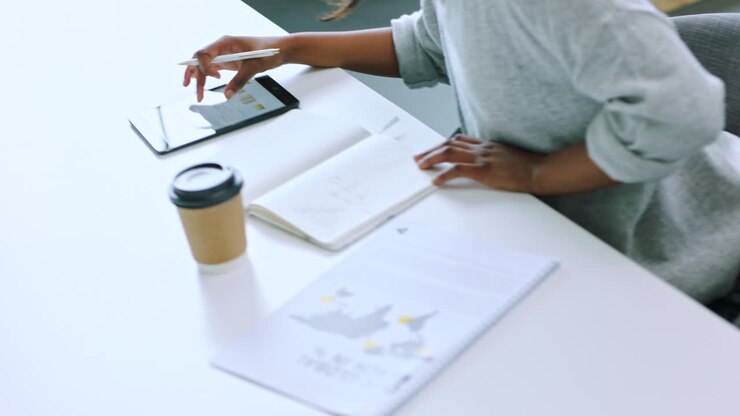 Business, woman and tablet while writing