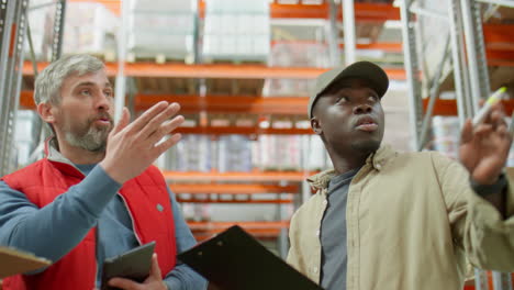 warehouse workers discussing inventory and logistics