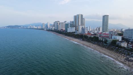 the beach is crowded with people bathing at nha trang vietnam