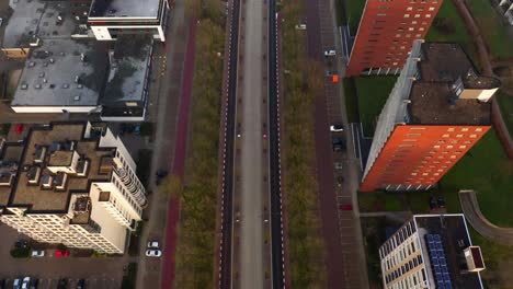 dutch buildings and neighborhoods during sunrise in the mist, shot by drone