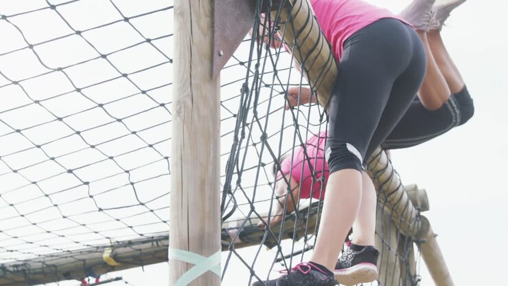 Female friends enjoying exercising at boot camp together