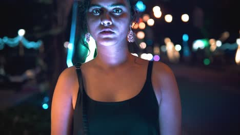 cinematic portrait shot of a girl with cool earrings, looking serious at the camera