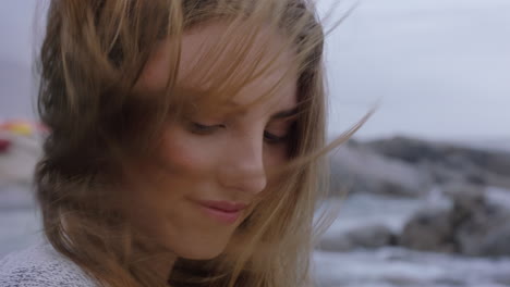 close-up-portrait-beautiful-woman-smiling-enjoying-beach-relaxing-on-seaside-wind-blowing-hair-exploring-peaceful-carefree-lifestyle