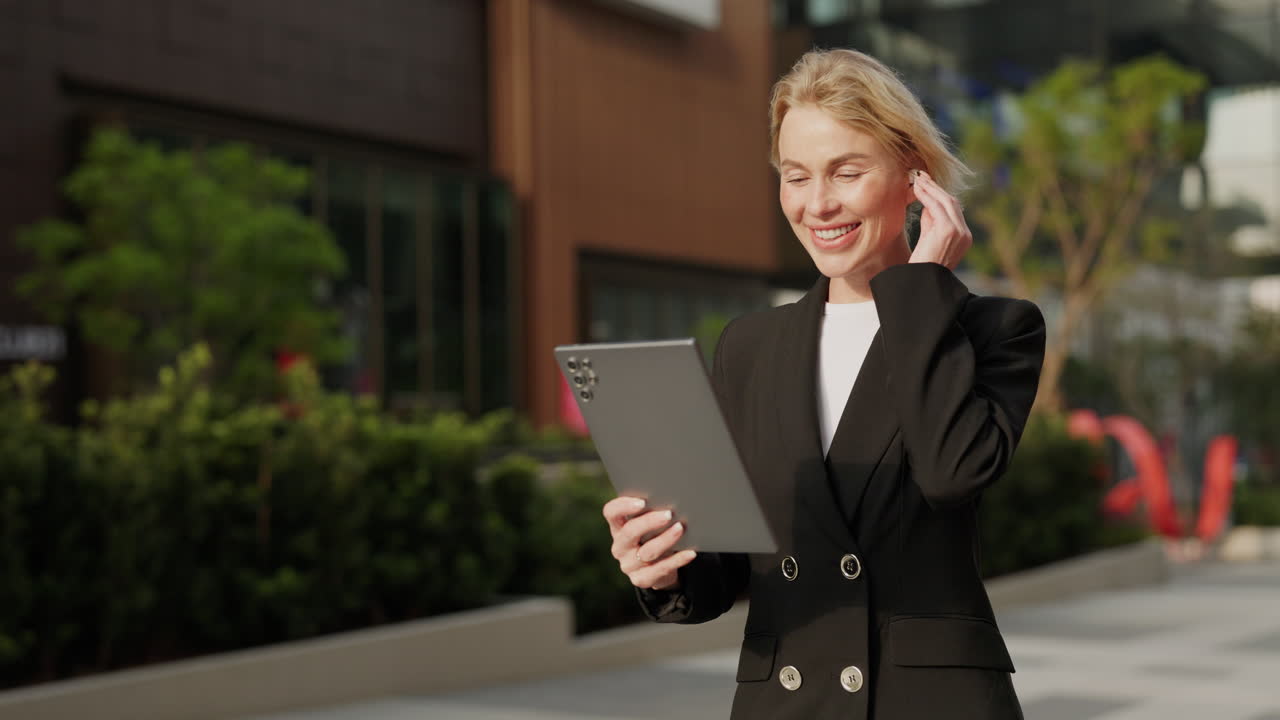 Businesswoman on Video Call with Tablet Outdoors