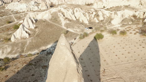 A-Big-Group-Of-Riders-Exploring-The-Scenic-Landscape-Of-Cappadocia-Turkey---aerial-shot