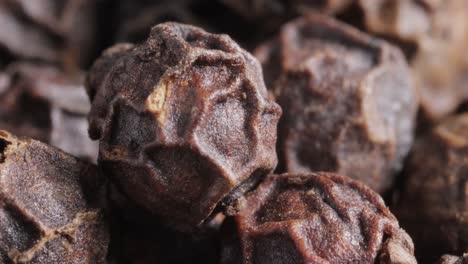 peppercorns or black pepper spice. super macro close up.