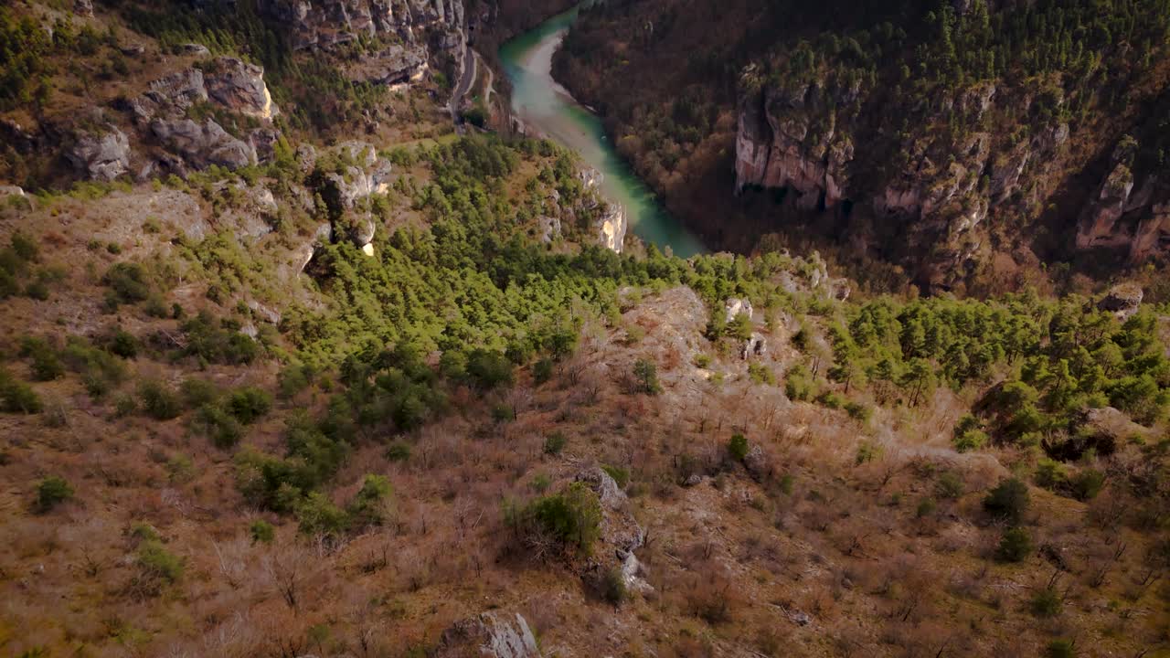 green river flows through steep canyon forest between Lozère and Aveyron