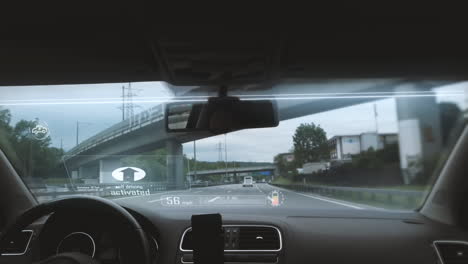 interior view of self-driving electric car system with digital hud screen windshield