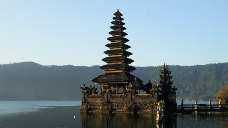 the majestic hindu temple pura segara ulun danu batur at the volcanic lake on bali in indonesia with view of the lake and nature during a summer trip through indonesia