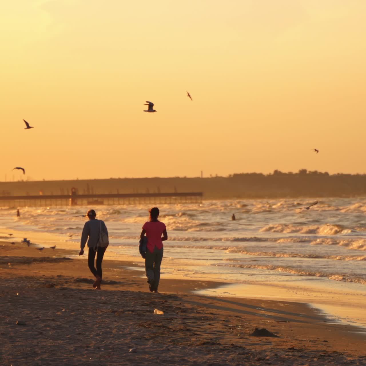 Girls walking on the beach