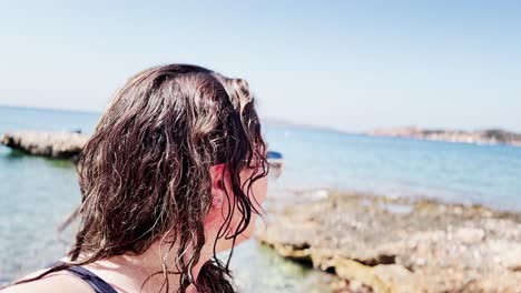 enthusiastic vlogger capturing beach moments at vouliagmeni lake