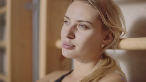 portrait of upset sportwoman looking camera in sport club.