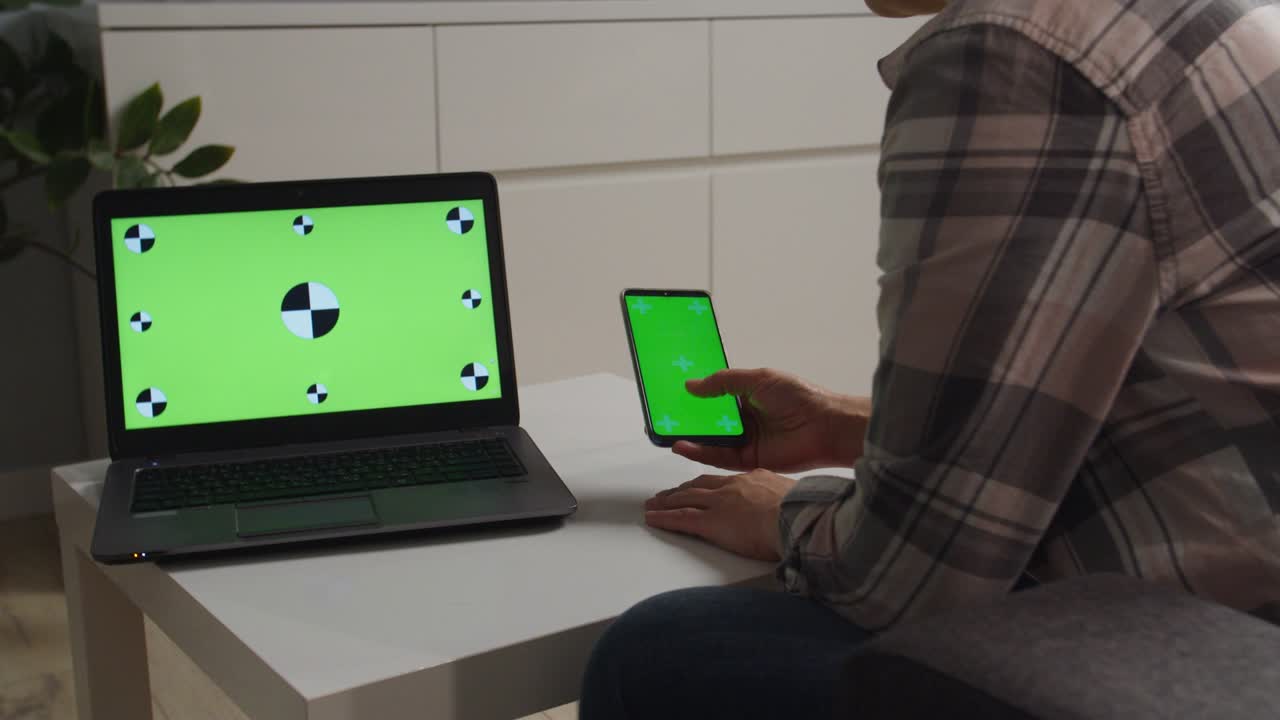 Side moving of camera, woman holding phone with chromakey green screen