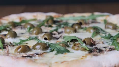 appetizing pizza on a wooden table in a restaurant