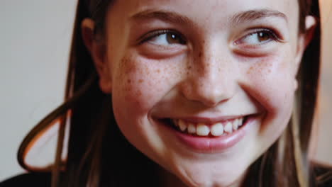 smiling girl with freckles