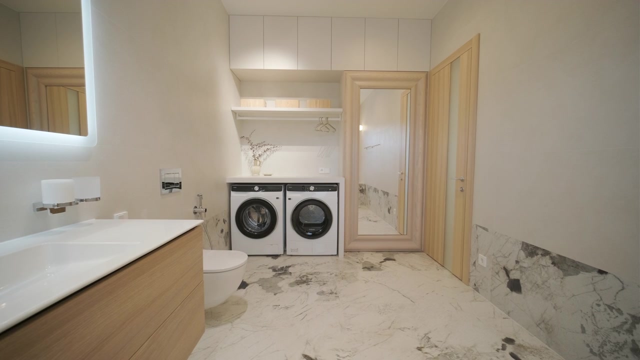 Modern Bathroom and Laundry Room Interior with Marble Flooring