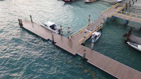 Sweet-couple-hugging-on-pier-at-harbor-of-Gili-Air-Island-during-holidays