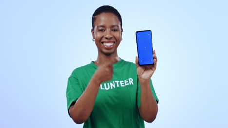 Volunteer,-pointing-and-phone-green-screen