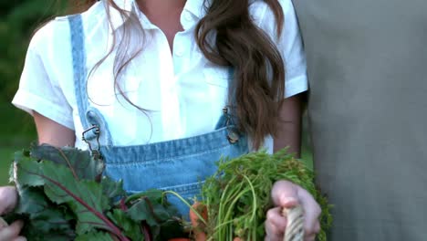 Gardener-smiling-couple-holding-basket