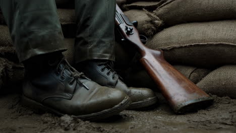 soldier in mud with rifle