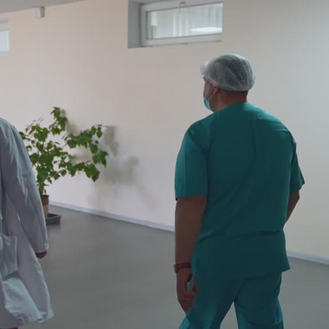 doctor walking corridor of hospital. male doctors walking along hospital corridor