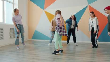 teenagers dancing in a dance studio