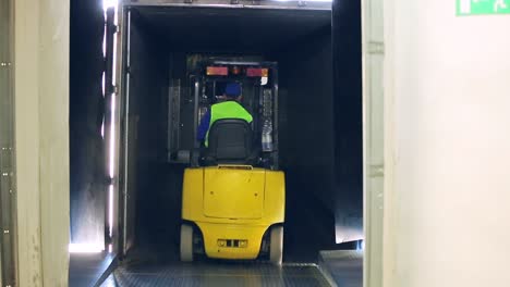 forklift moves in dairy factory warehouse. milk delivery