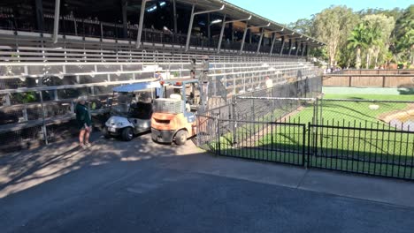 forklift moving equipment with staff assistance