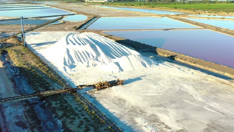 salt extraction from the air in the purple lakes of medieval aigues-mortes in the camargue in southern france-2