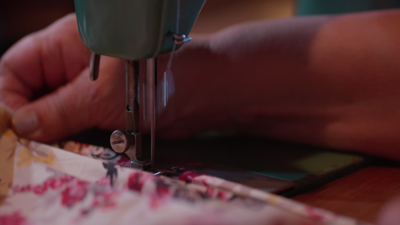 Close Up of Hands Sewing Fabric on a Vintage Sewing Machine