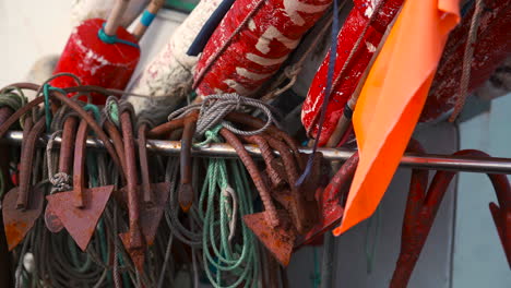 Anchors-hanging-on-the-side-of-the-fishing-boat-near-the-ocean