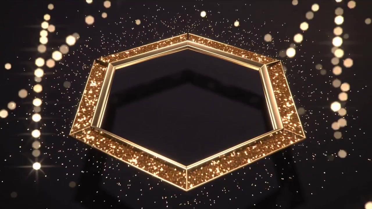 Gyllene sexkantig ram som dyker upp, roterar och avger glitter medan den landar på glansigt golv, bokeh