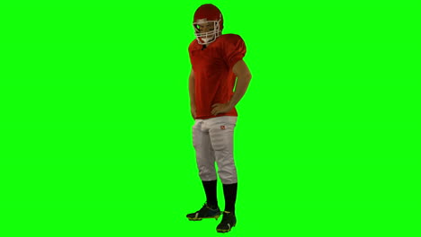 jogador de futebol americano vermelho posando
