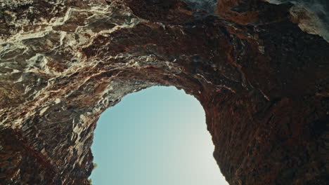 stunning cave houses on a cliffside overlooking the ocean