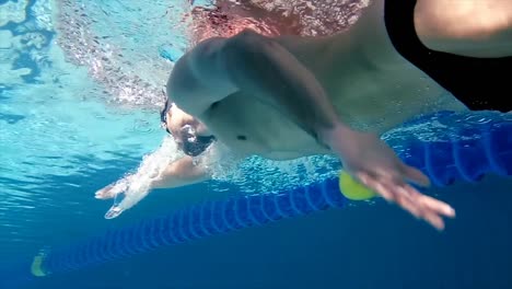 underwater view of man swimming