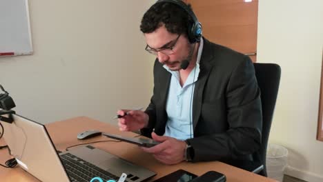 data analysis: man with tablet in virtual meeting