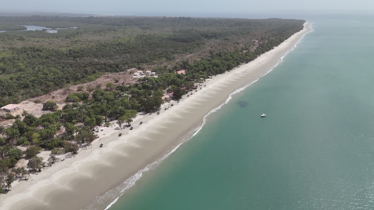 Aerial high angle wide view of Long white sand beach stretching along turquoise sea in the Bijagos Islands, West Africa