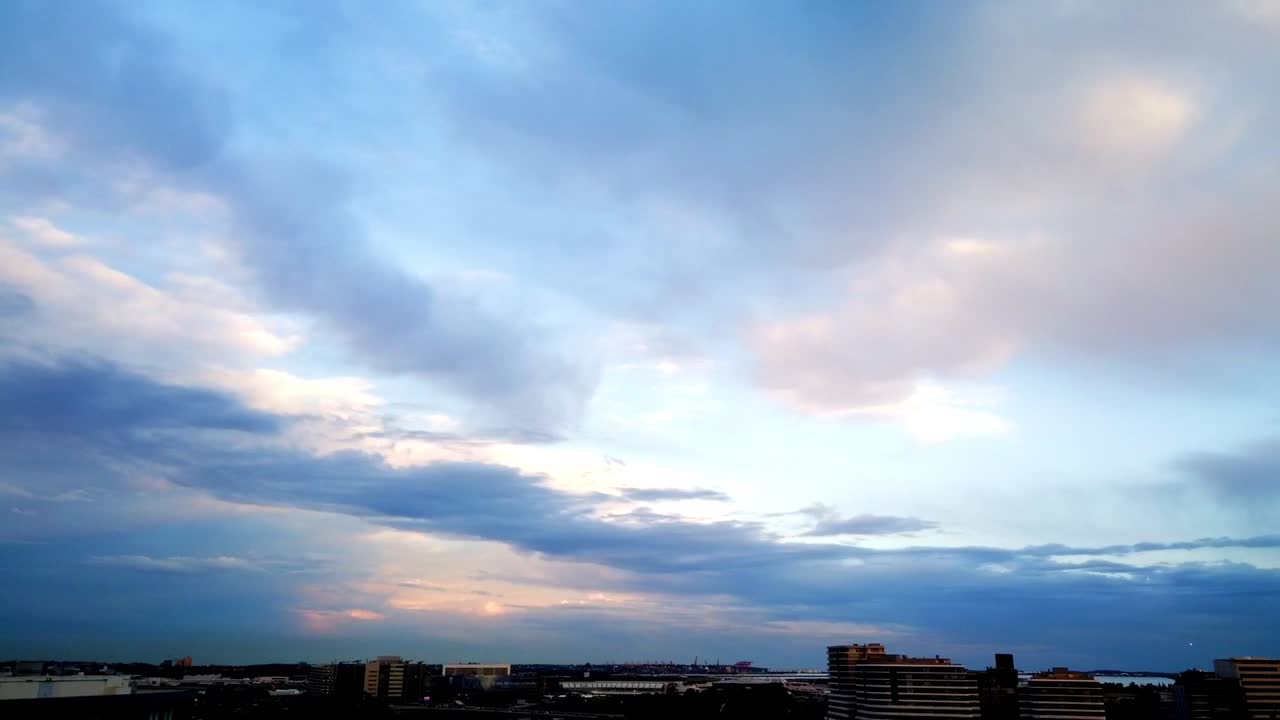 Beautiful sunset cloud timelapse with a moon and airport view. Sydney, Australia.