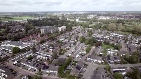 wide aerial view of shopping mal car parking lot in dutch residential neighbourhood