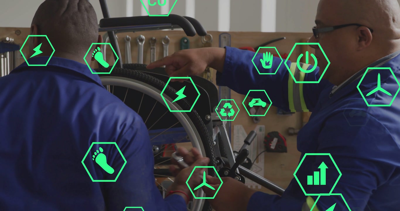 Two techs repairing medical wheelchair, introducing drill and showing green hex icons for alignment
