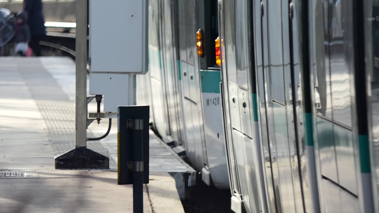 modern White and green Tram going out of the station