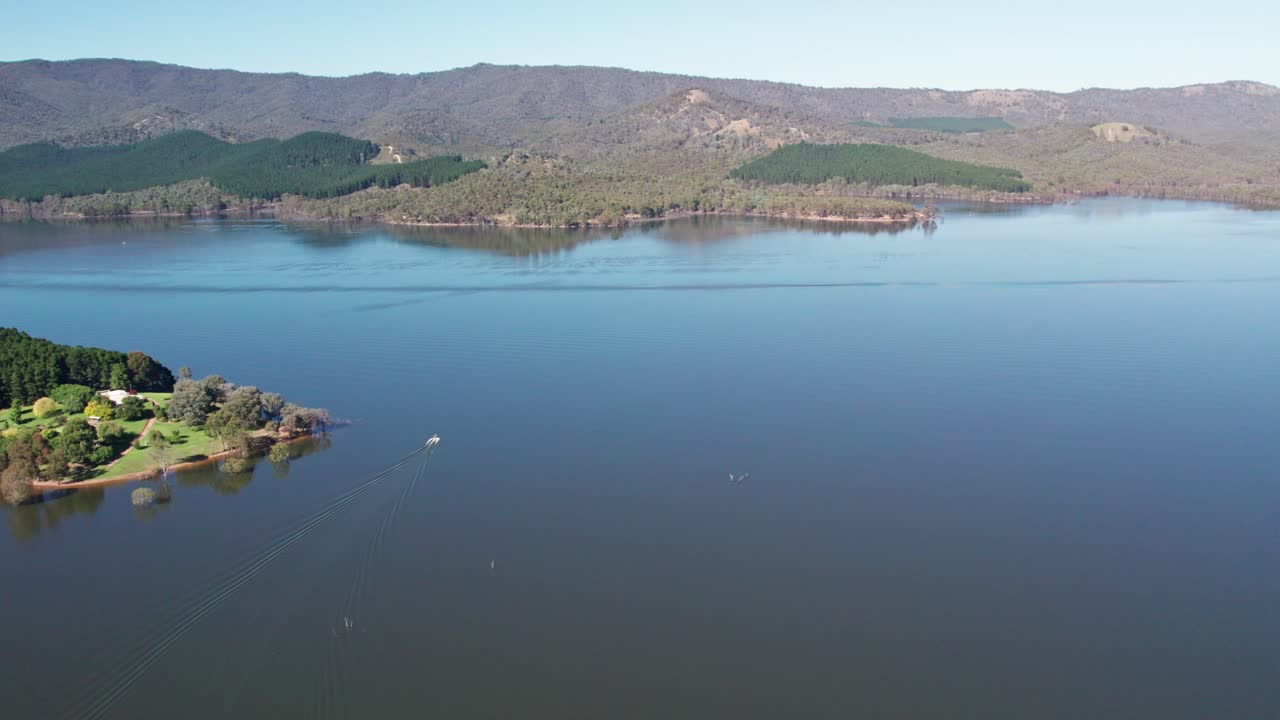 Reversing drone footage of a speed boat on Lake Eildon, near Mansfield in central Victoria, Australia. The storage was 97% full. February 2024.