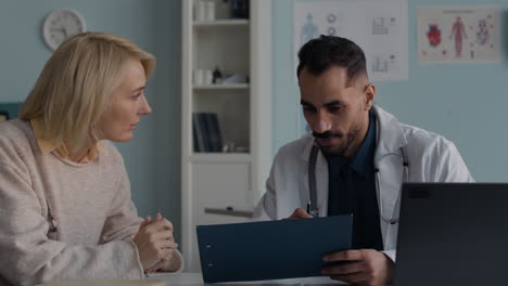 doctor consulting with patient in clinic