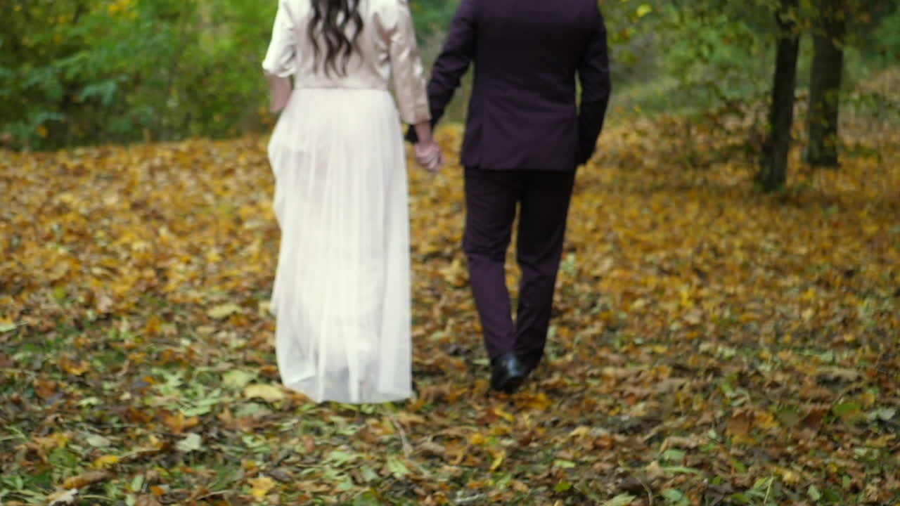 Bride and groom walking hand in hand