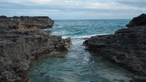 Blue-water-crashing-on-the-rocks