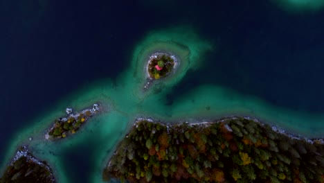 aerial view of a secluded island lake house in autumn