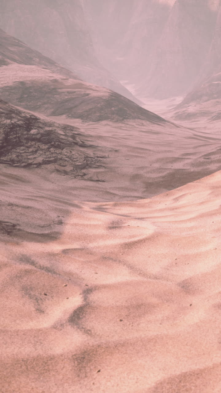 paisaje desértico con dunas de arena y montañas