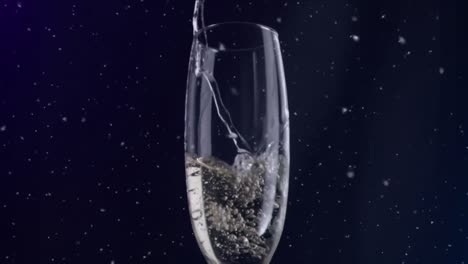 animation of white specks floating over glass of champagne on black background