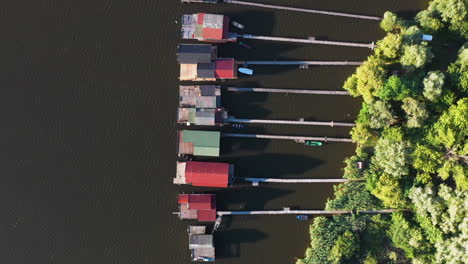 Drone-shot-of-Bokodi-hutoto-lake-in-Hungary-aerial-shot-with-small-village