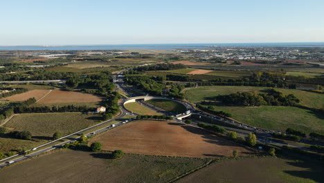 Birds-eye-view-of-a-major-roundabout-in-Montpellier,-where-urban-infrastructure